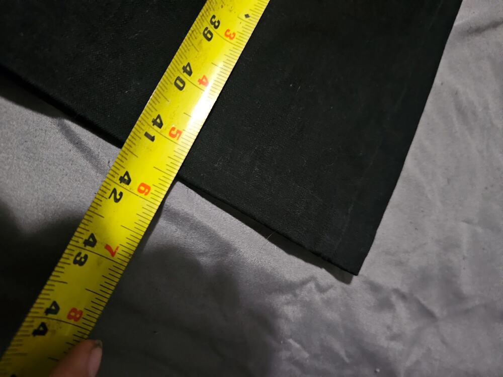 Black dress pants with straight leg and hemmed cuffs